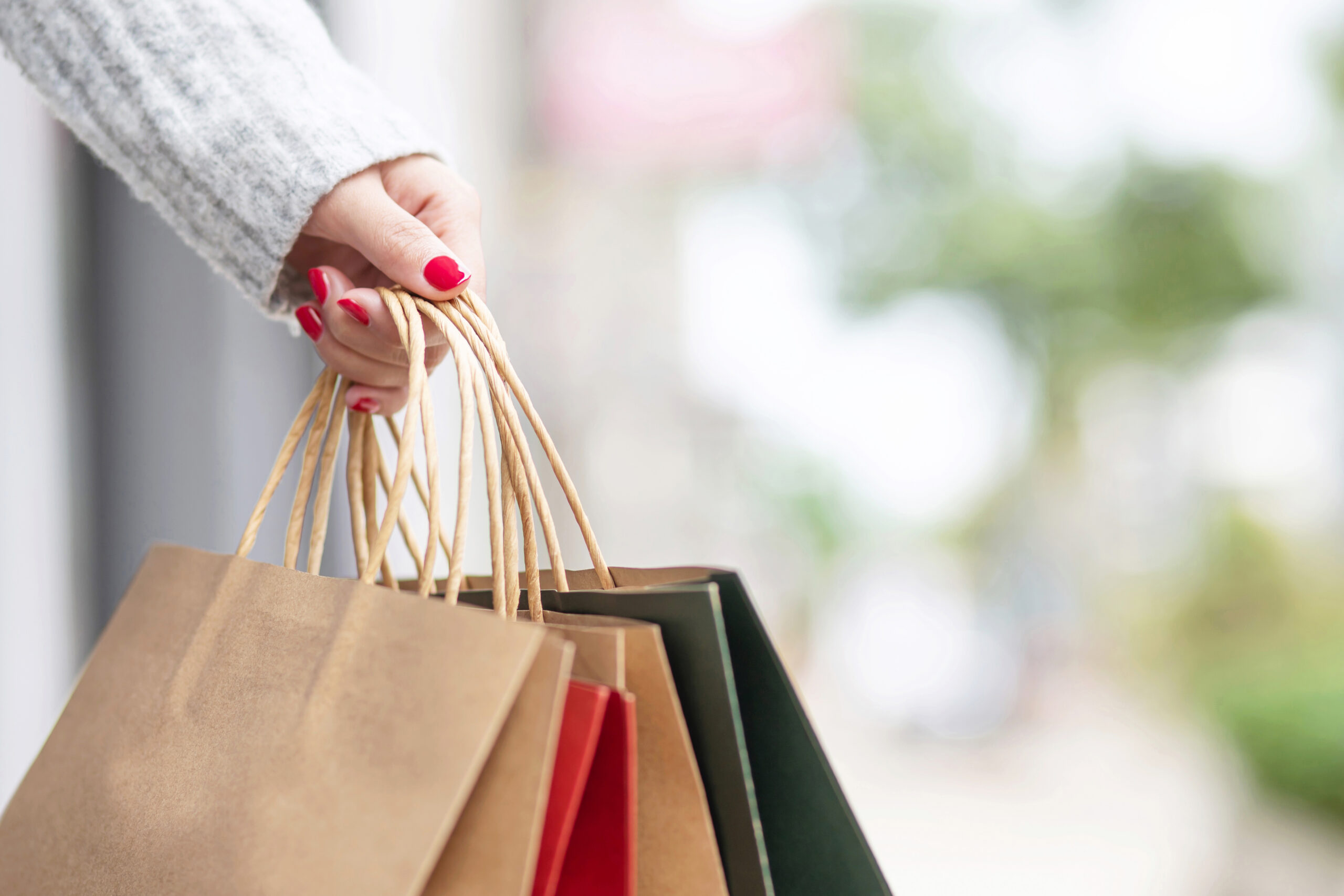 Woman holding shopping bags in a mall
